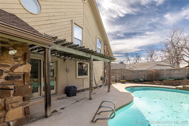 view of swimming pool with a patio, fence, a fenced in pool, and a pergola