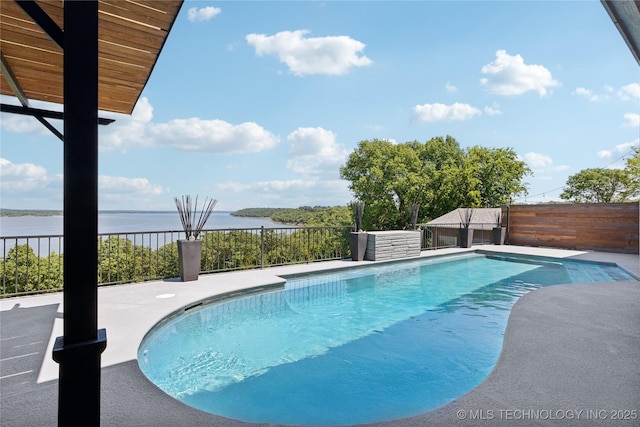 view of pool featuring a water view, fence private yard, and a fenced in pool