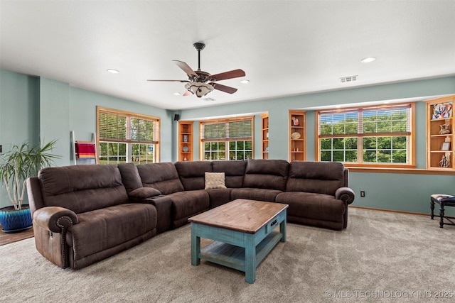 living room with visible vents, baseboards, light colored carpet, ceiling fan, and recessed lighting