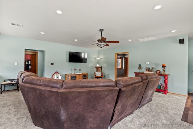 living area with light carpet, ceiling fan, visible vents, and recessed lighting