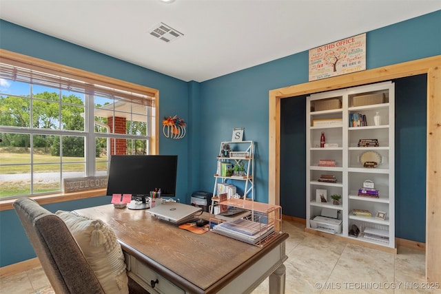 home office with baseboards and visible vents