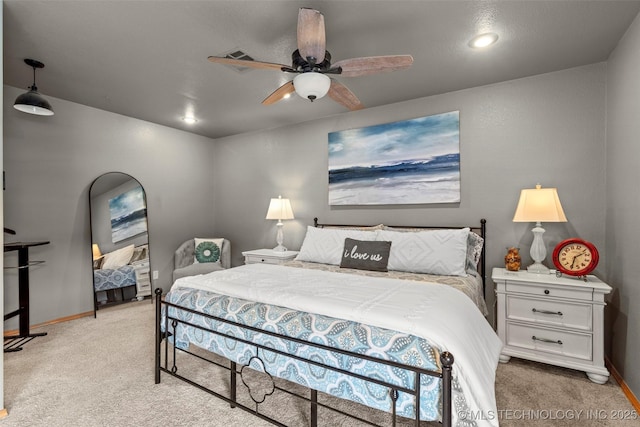 bedroom with light carpet, ceiling fan, and baseboards