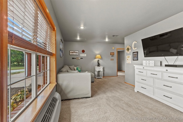 bedroom featuring light carpet, visible vents, and baseboards