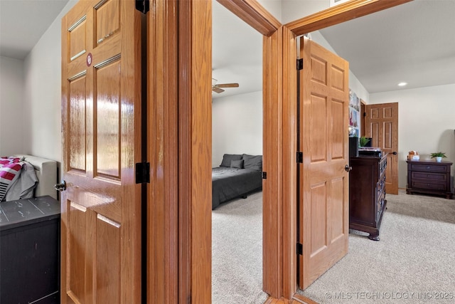 hall featuring recessed lighting and light colored carpet