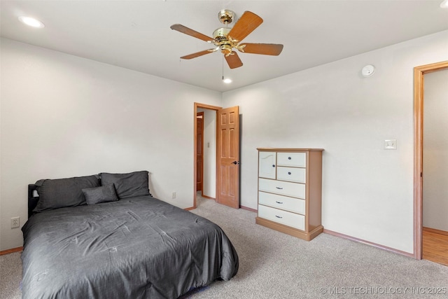 carpeted bedroom with ceiling fan, baseboards, and recessed lighting