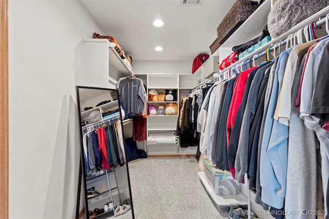 walk in closet featuring carpet floors and visible vents