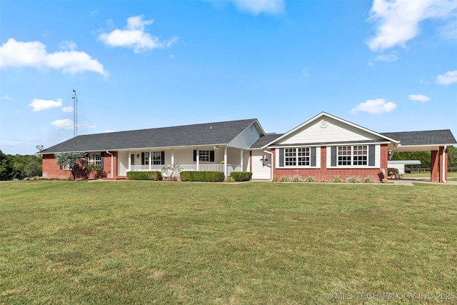 ranch-style home featuring covered porch, a front lawn, a carport, and brick siding