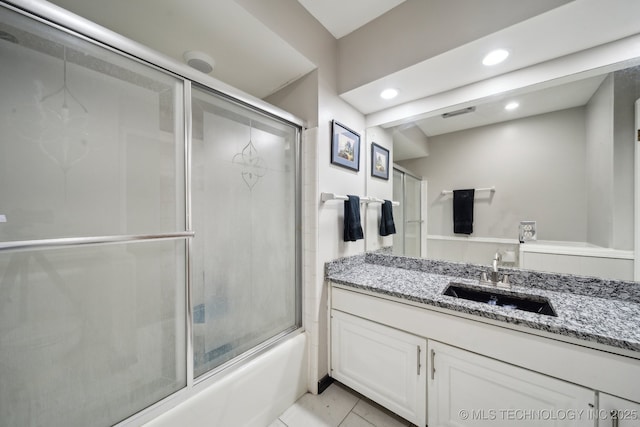 bathroom featuring shower / bath combination with glass door, vanity, and recessed lighting