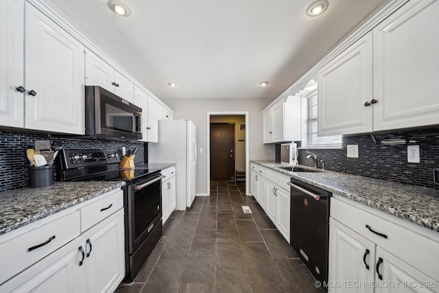 kitchen with stone counters, a sink, white cabinetry, black dishwasher, and stainless steel range with electric stovetop