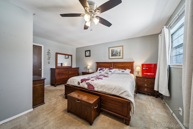 bedroom with baseboards, a ceiling fan, and light colored carpet