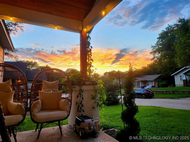 patio terrace at dusk with a lawn