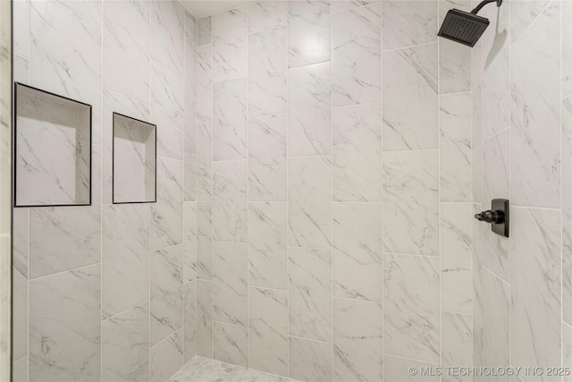 details with a tile shower