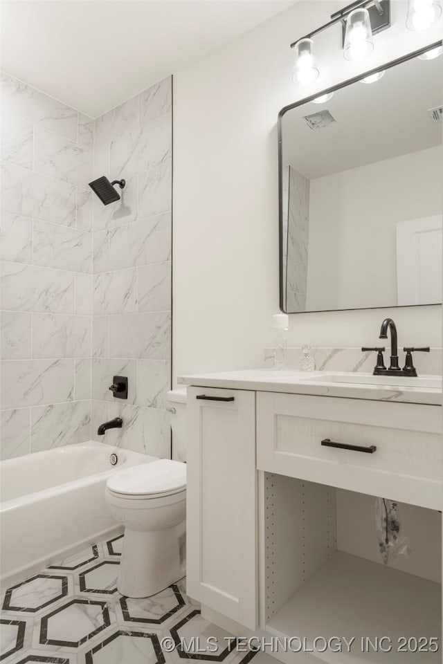 full bathroom with toilet, washtub / shower combination, visible vents, and vanity