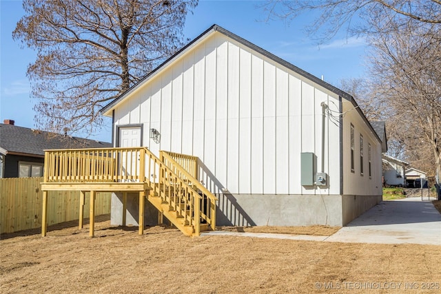 exterior space featuring stairs, a deck, and board and batten siding