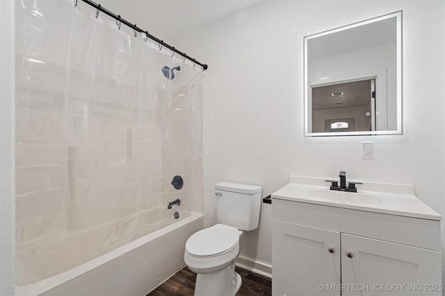 full bath with shower / tub combo, vanity, toilet, and wood finished floors