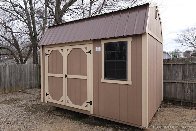 view of shed featuring a fenced backyard