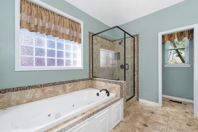 full bathroom featuring visible vents, a stall shower, tile patterned flooring, baseboards, and a tub with jets