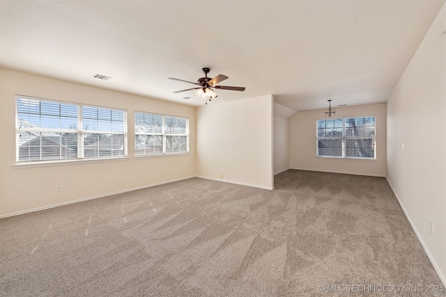 unfurnished room with light carpet, visible vents, and a healthy amount of sunlight