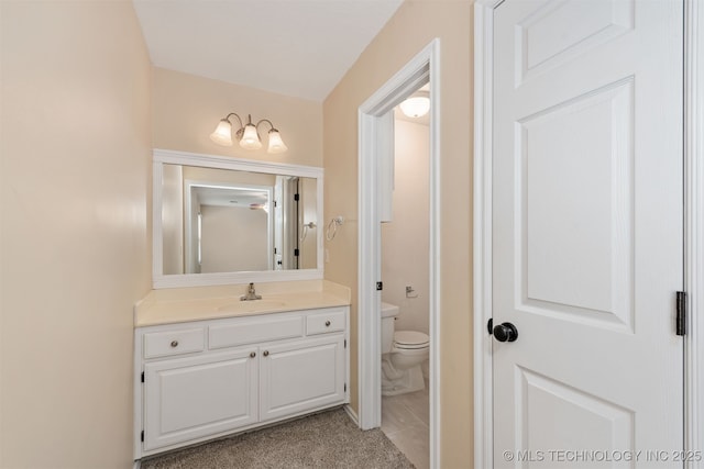 bathroom featuring vanity and toilet