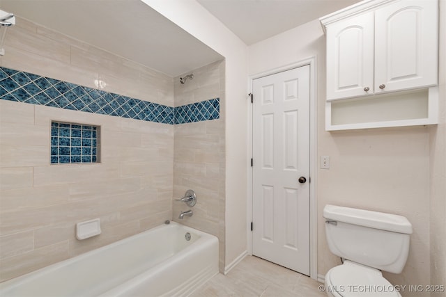 full bathroom featuring toilet, tile patterned floors, baseboards, and shower / bathtub combination