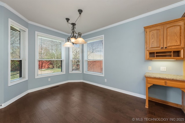 unfurnished dining area featuring visible vents, baseboards, dark wood finished floors, and crown molding