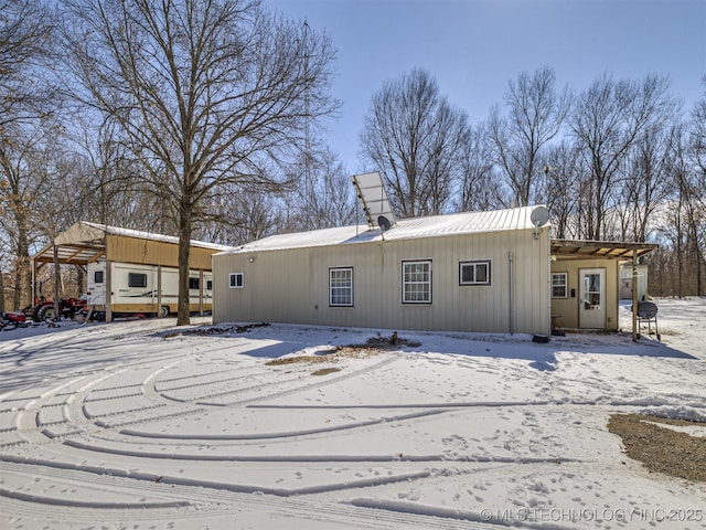 view of snow covered house