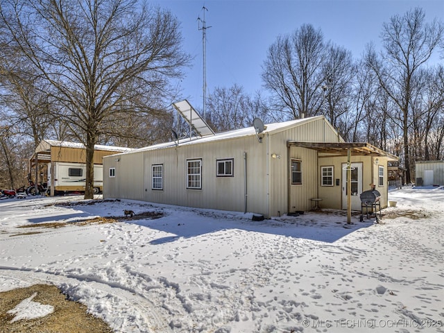 view of snow covered house