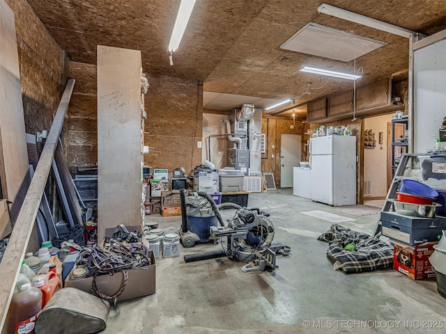 misc room with washer / dryer and unfinished concrete floors