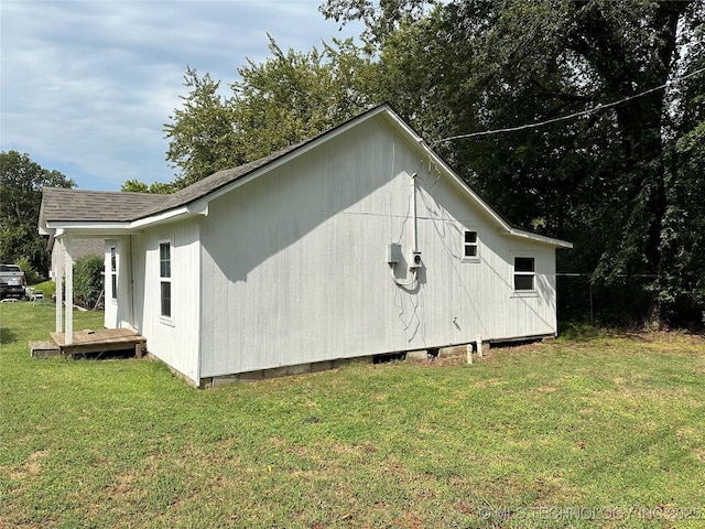 729 W 13th, Ada, OK 74820 - view of side of home with a yard