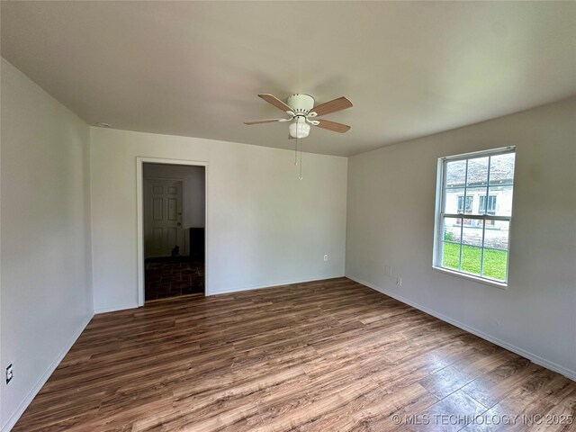 729 W 13th, Ada, OK 74820 - spare room featuring wood finished floors and ceiling fan