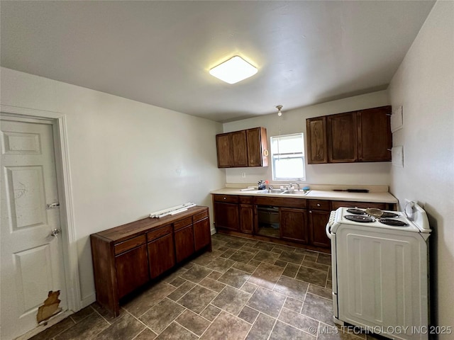 729 W 13th, Ada, OK 74820 - kitchen with white electric range, dark stone finish floors, and light countertops