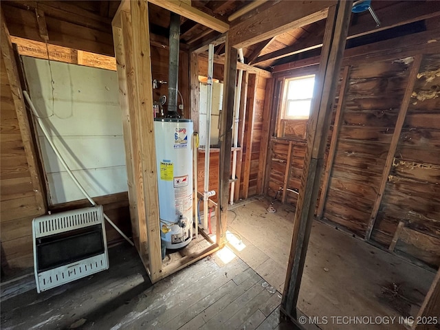 729 W 13th, Ada, OK 74820 - utility room with gas water heater and heating unit
