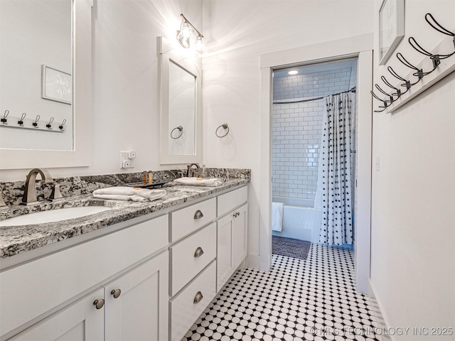 full bathroom with double vanity, a sink, and shower / tub combo with curtain