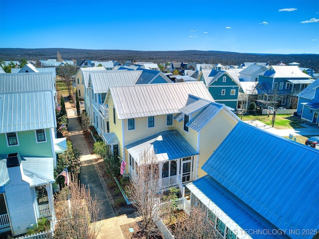 birds eye view of property with a residential view