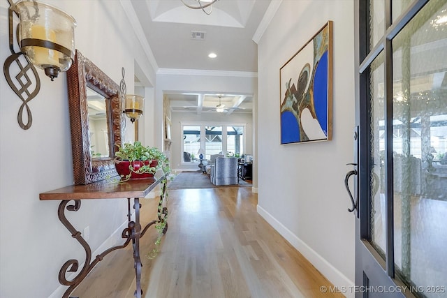 entryway with beam ceiling, visible vents, wood finished floors, coffered ceiling, and baseboards