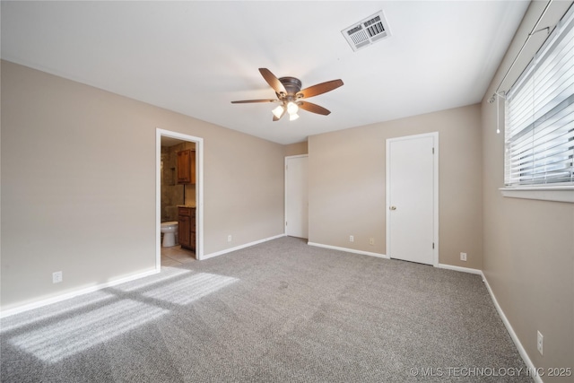 unfurnished bedroom with light carpet, ensuite bath, baseboards, and visible vents