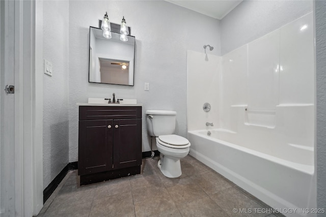 full bath with tile patterned flooring, toilet, vanity, baseboards, and shower / bathing tub combination