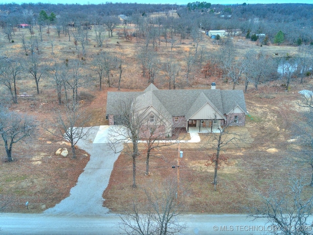 birds eye view of property with a rural view