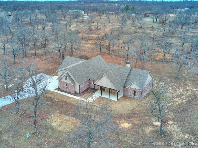 birds eye view of property featuring a rural view