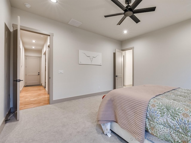 bedroom with baseboards, ceiling fan, recessed lighting, and light colored carpet