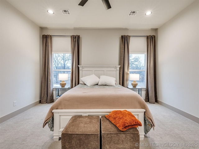 bedroom with light carpet, multiple windows, and visible vents