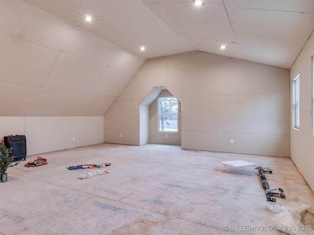 additional living space featuring vaulted ceiling