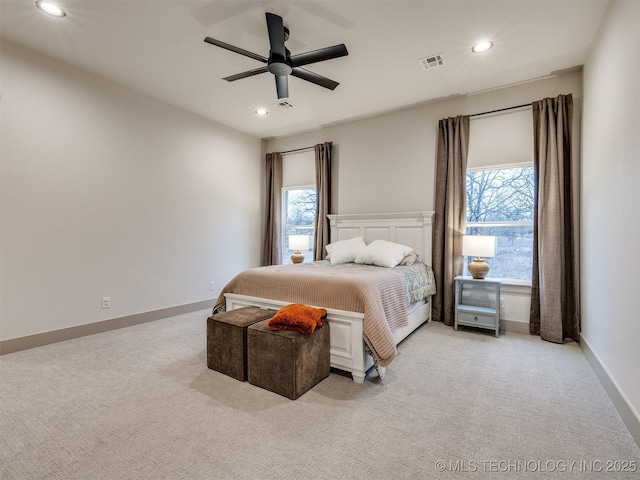 bedroom with light carpet, multiple windows, visible vents, and recessed lighting