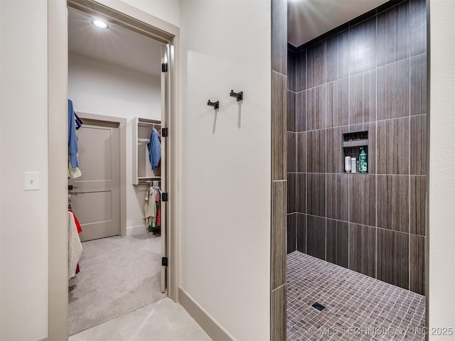 full bath with a tile shower