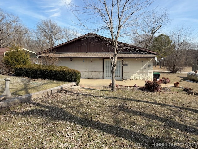 view of side of property featuring a patio area