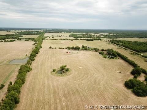 birds eye view of property with a rural view