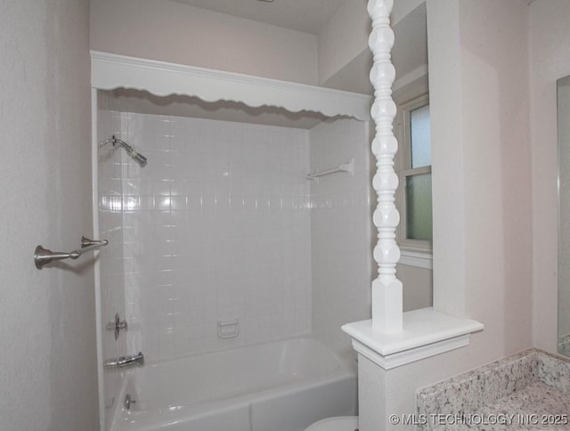 full bath featuring toilet and washtub / shower combination