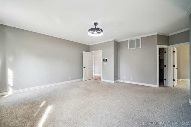 unfurnished room with light carpet, ornamental molding, visible vents, and baseboards