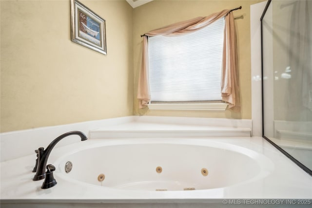 bathroom with a whirlpool tub