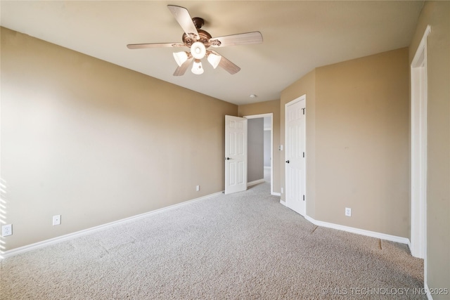 unfurnished bedroom featuring light colored carpet, ceiling fan, and baseboards